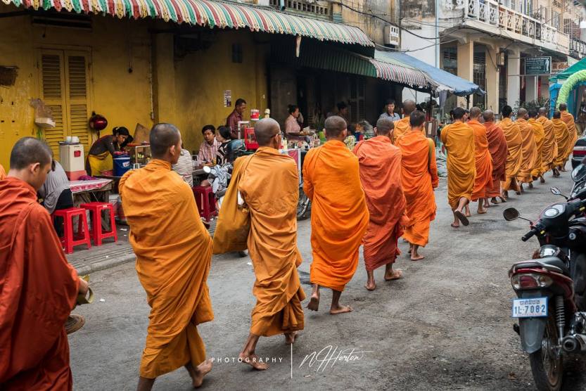 Monks collecting alms in Battambang_ Cambodia