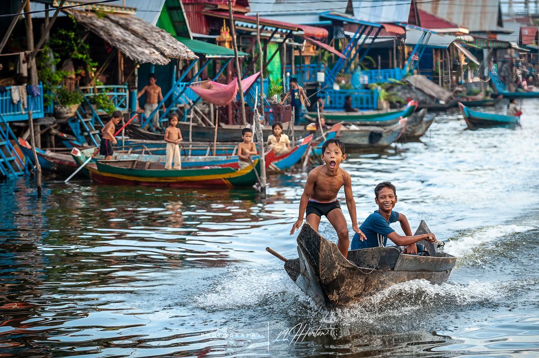 Children playing in a boat_ Kompong Phluk_ Cambodia