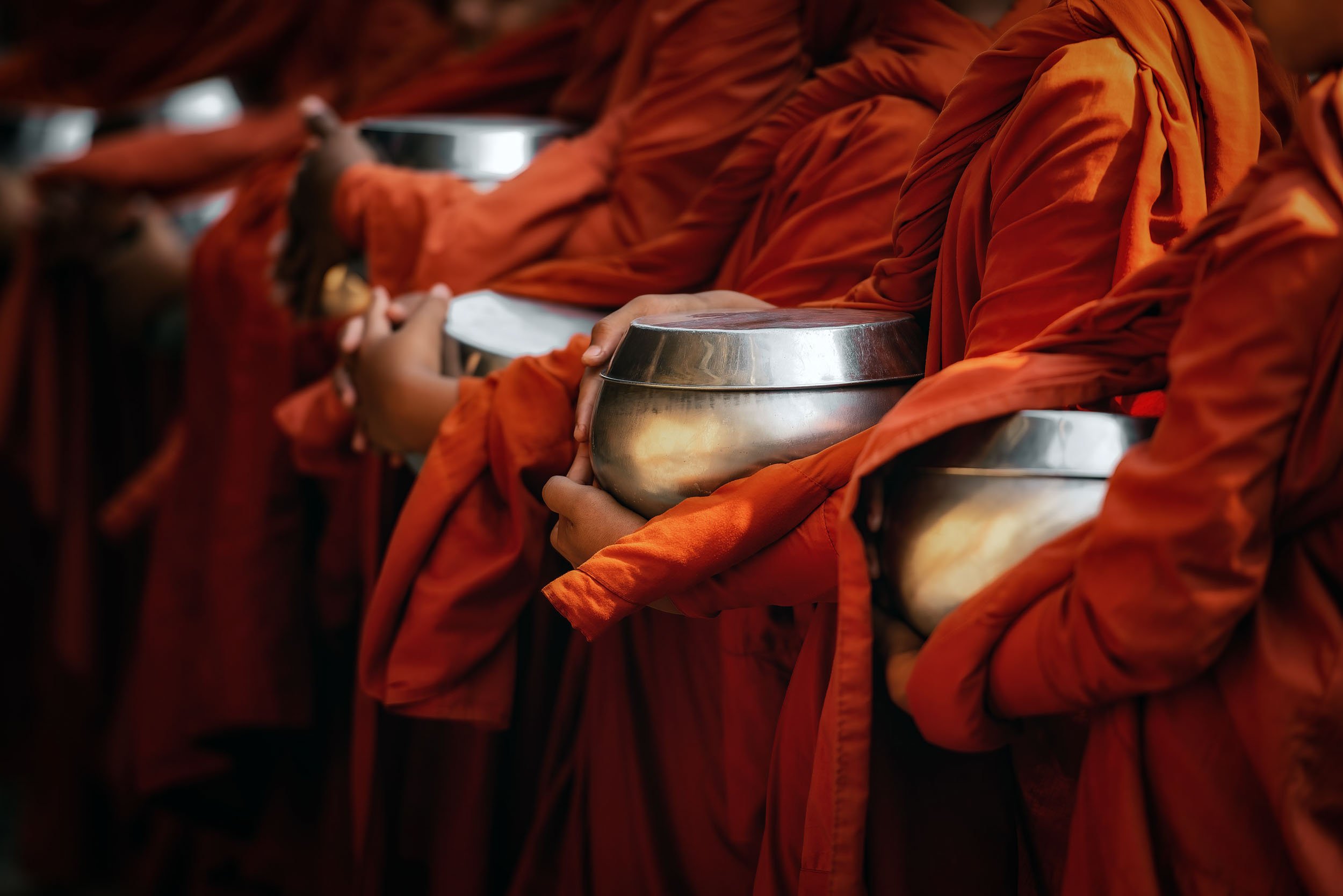 Monks-alms-bowls-orange-robes-Cambodia